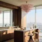 Pink Murano palmette chandelier hanging in bar.