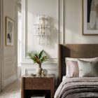 18 transparent tube sconces hanging in bedroom